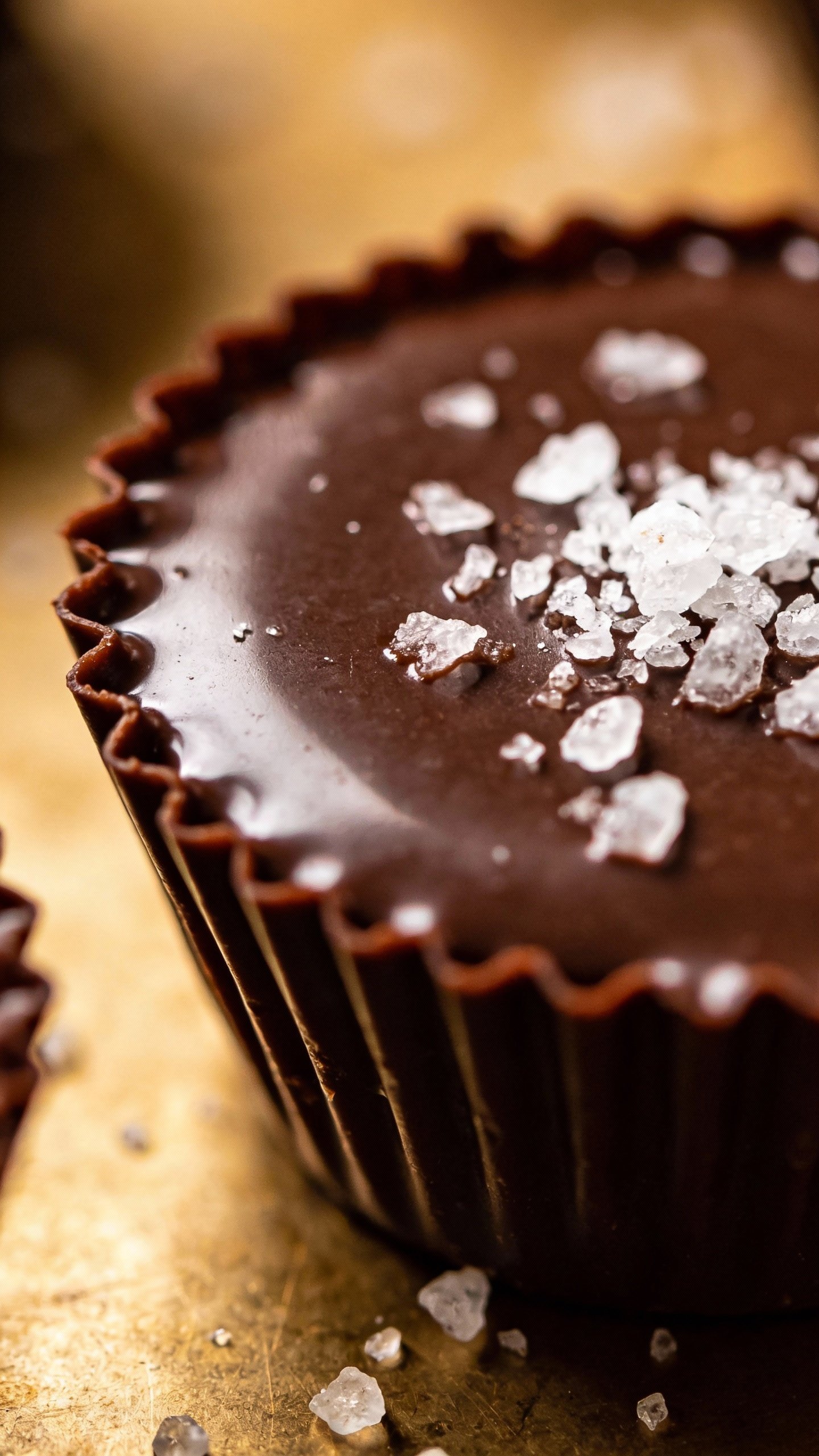 glossy keto chocolate cup with flaky sea salt topping