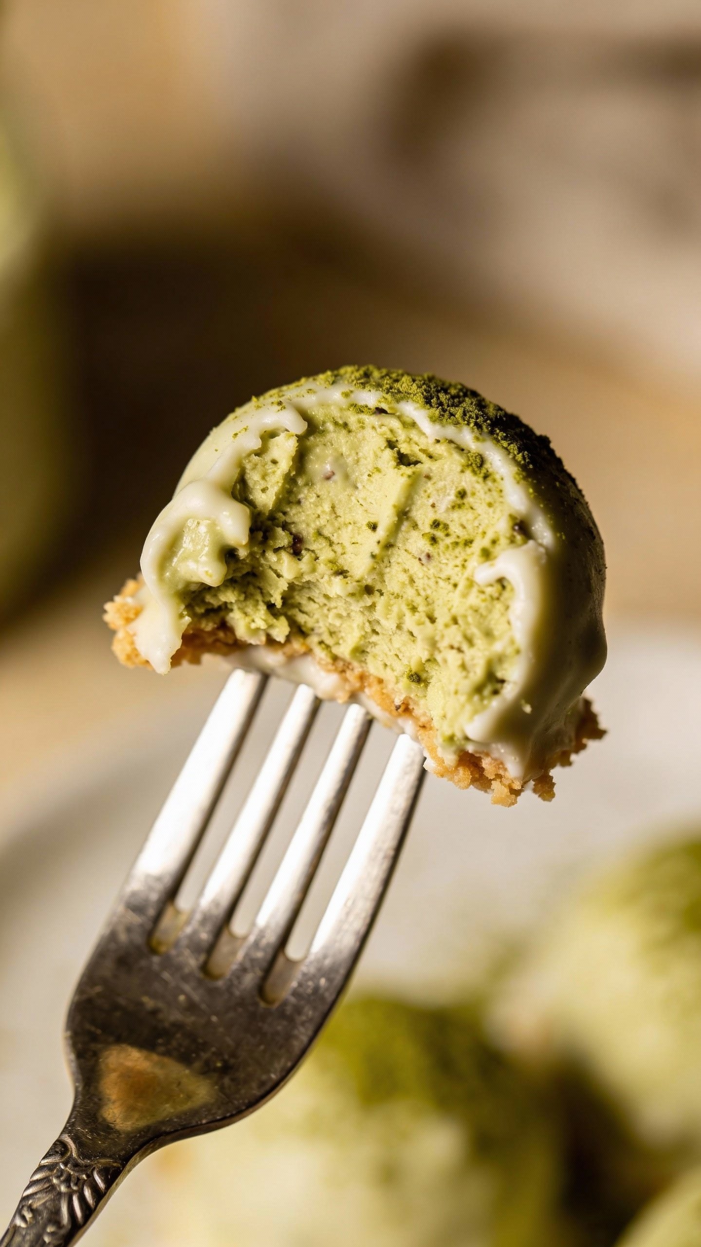 single bite of keto matcha white chocolate fat bomb on fork