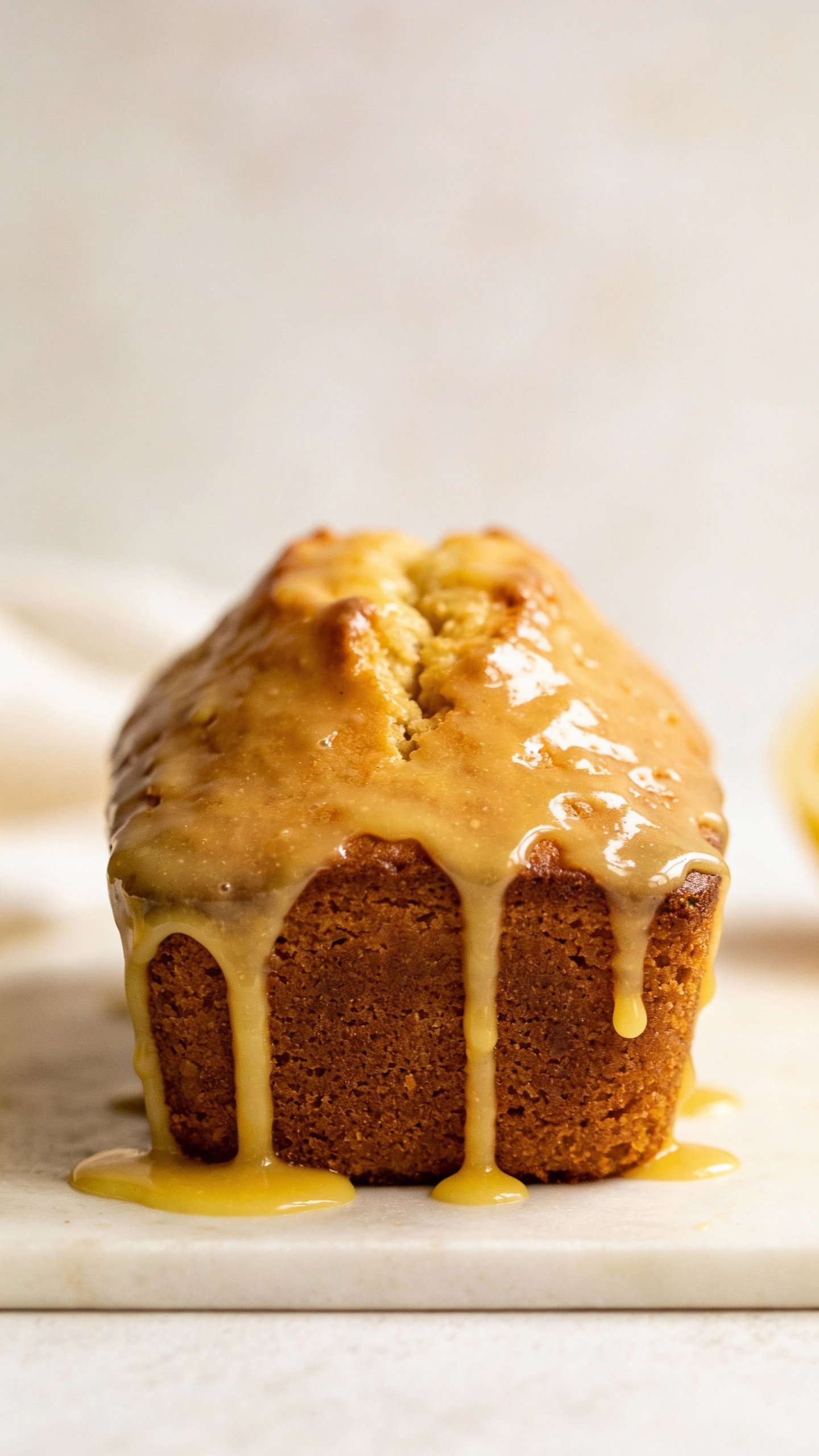 single keto lemon pound cake loaf with lemon glaze, closeup