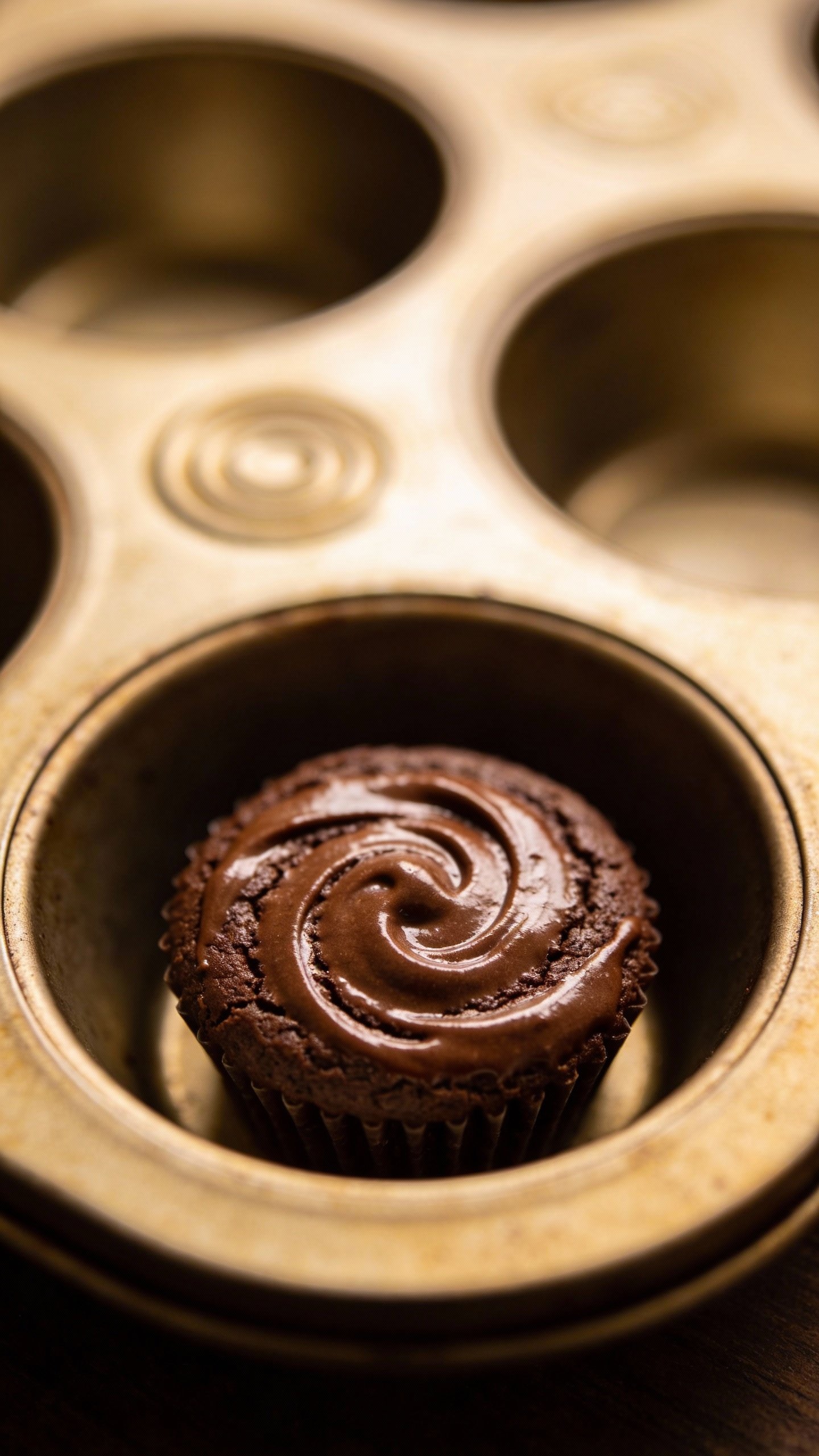 single mini muffin tin cavity with swirled brownie bite