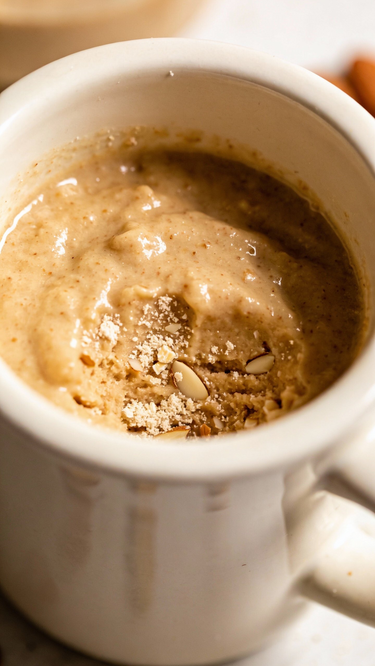 Almond flour keto mug cake batter in mug before microwaving, overhead closeup
