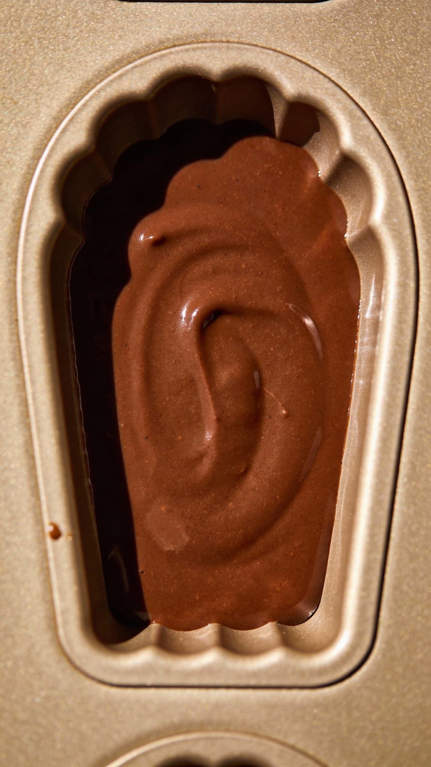 single silicone mold cavity filled with keto chocolate mixture