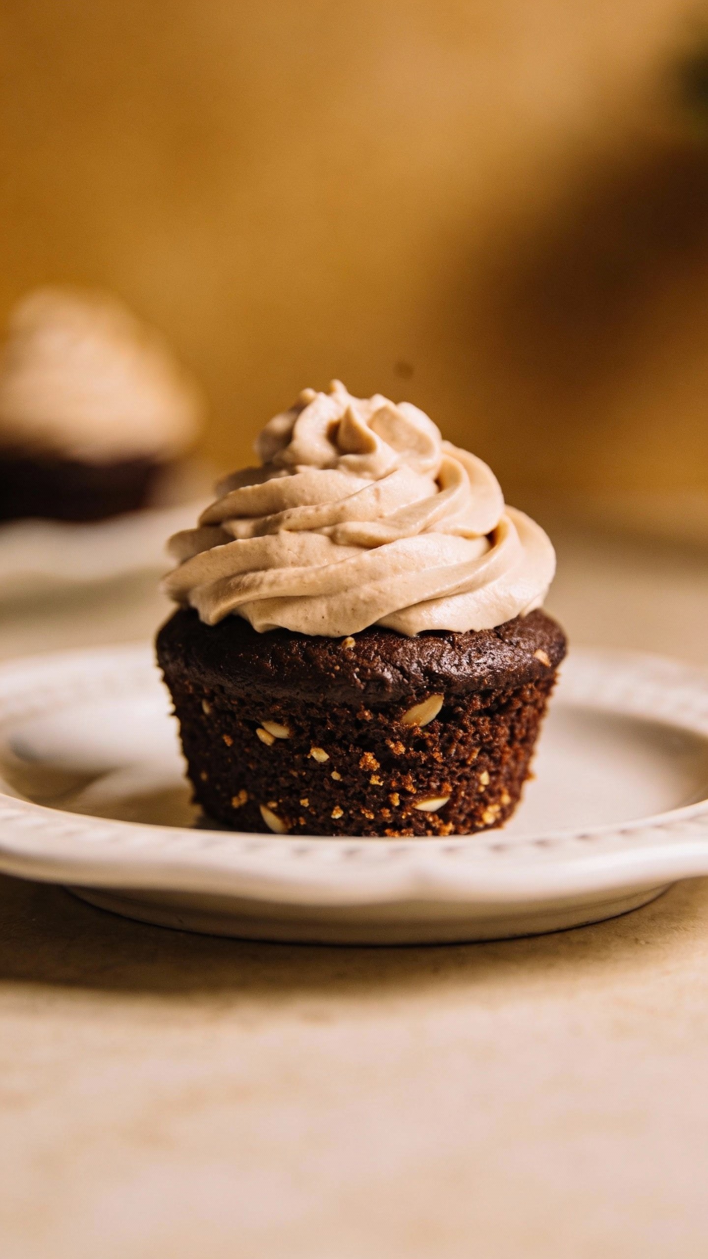 single keto chocolate cupcake with almond flour crumb, soft frosting