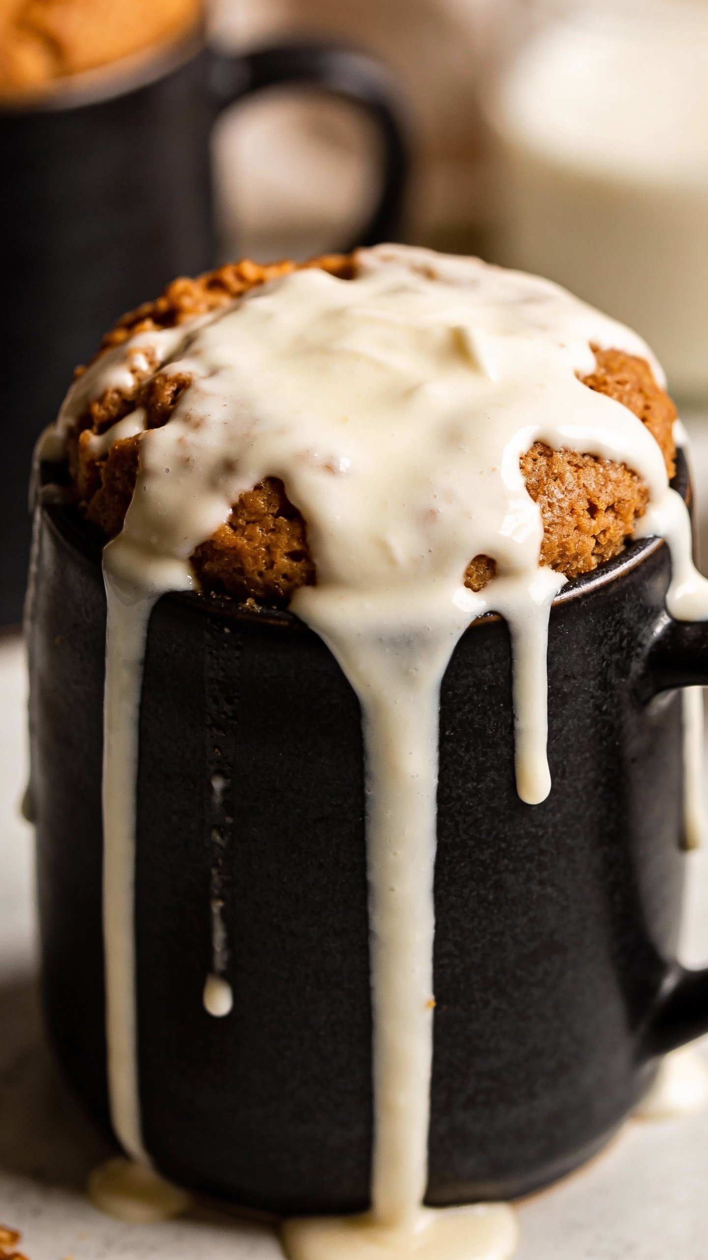 cream cheese drizzle on keto mug cake, matte black mug