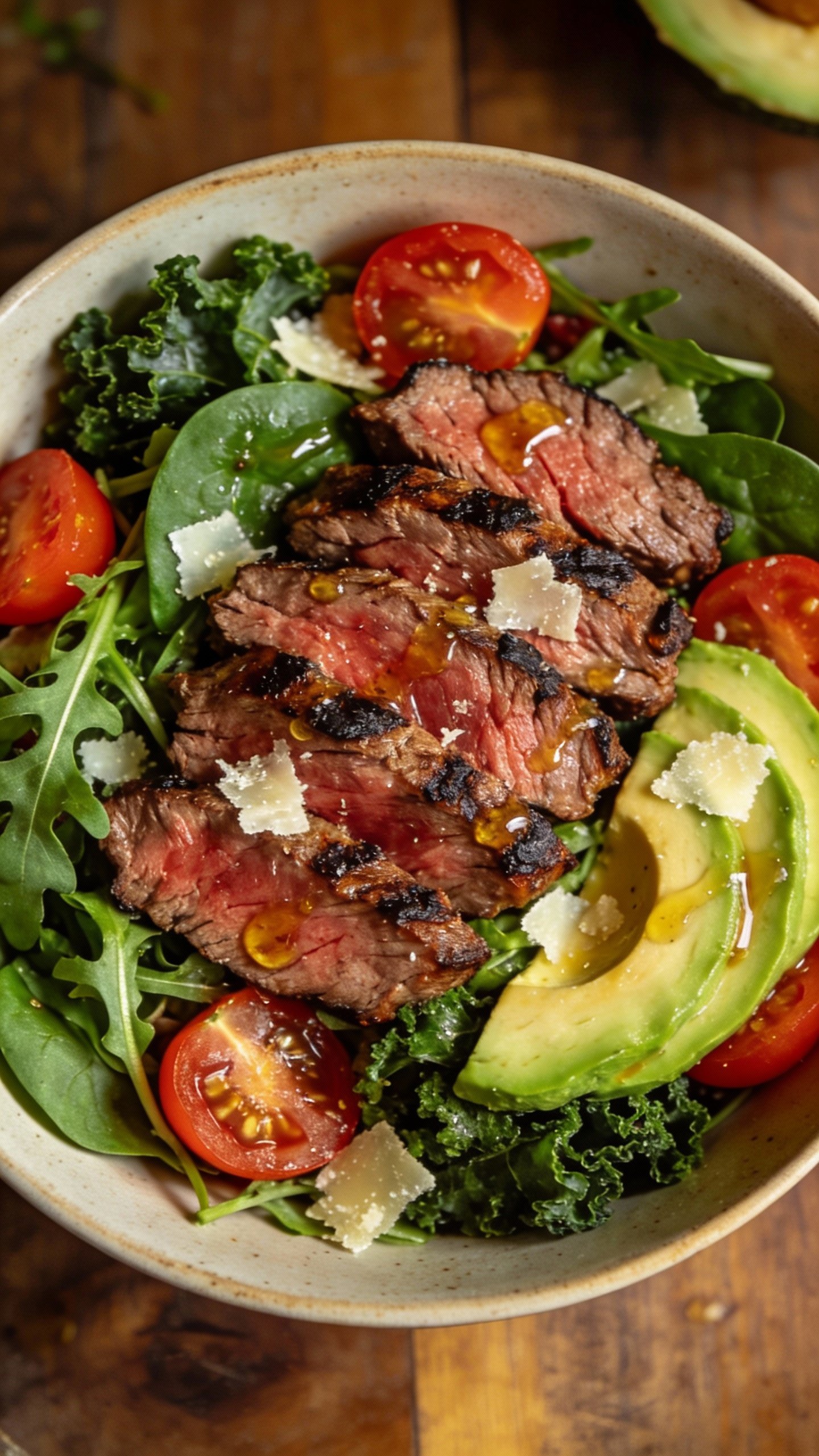 single bowl keto steak salad with parmesan shavings, overhead