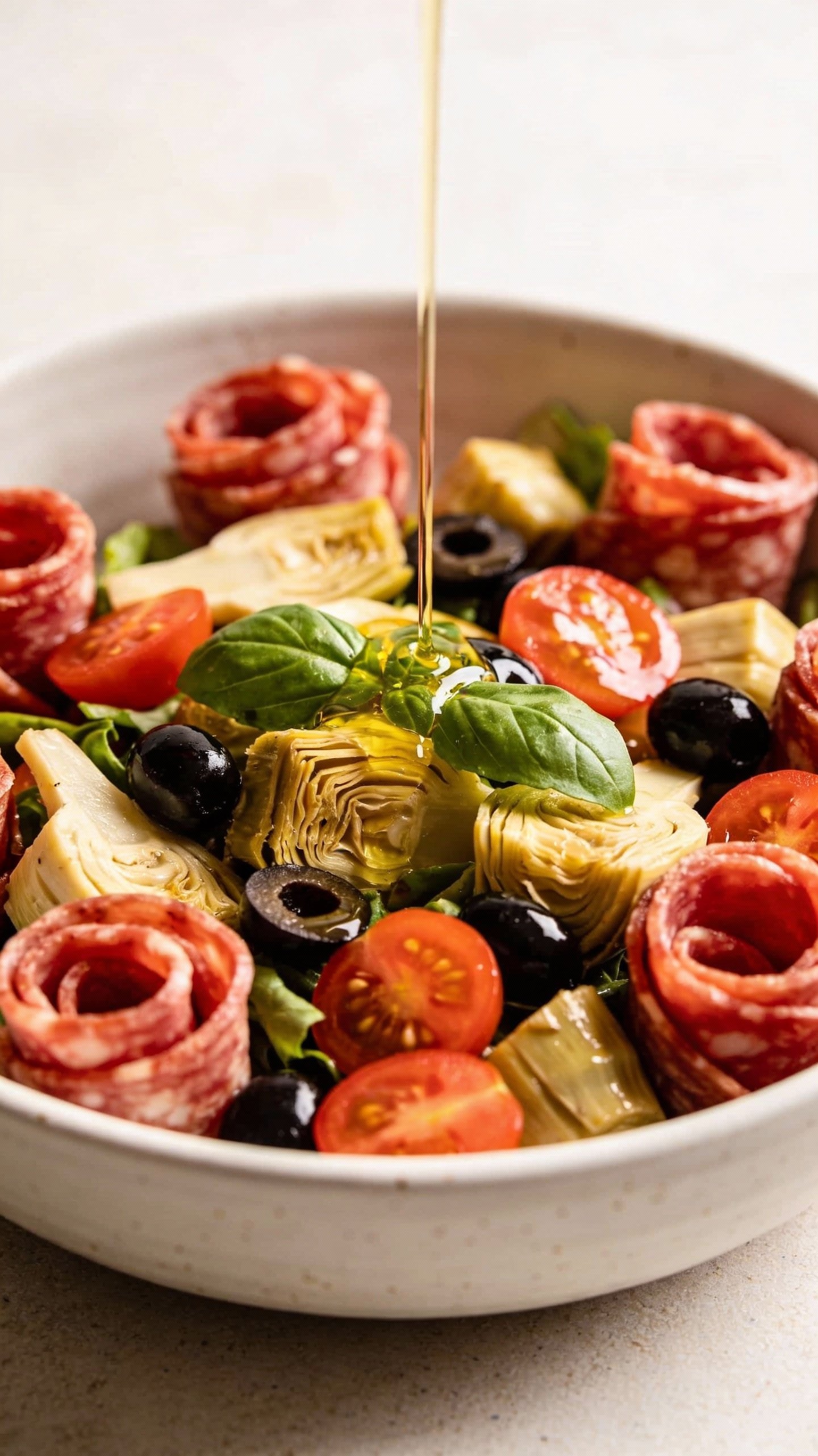 closeup bowl of keto antipasto salad with salami rosettes