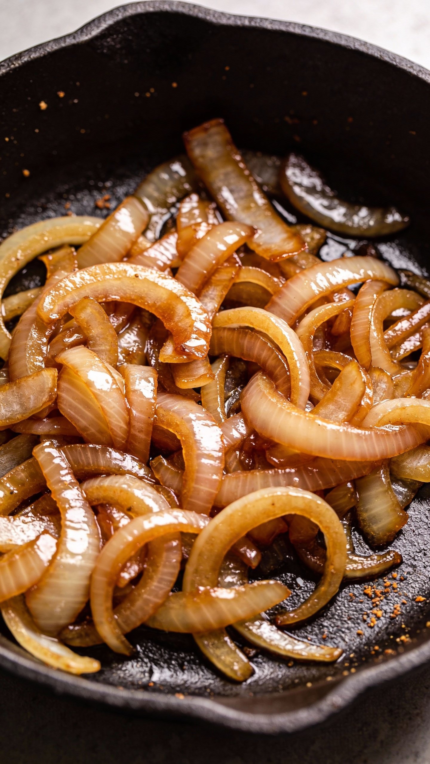 caramelized onions on cast-iron skillet, glossy low-carb style