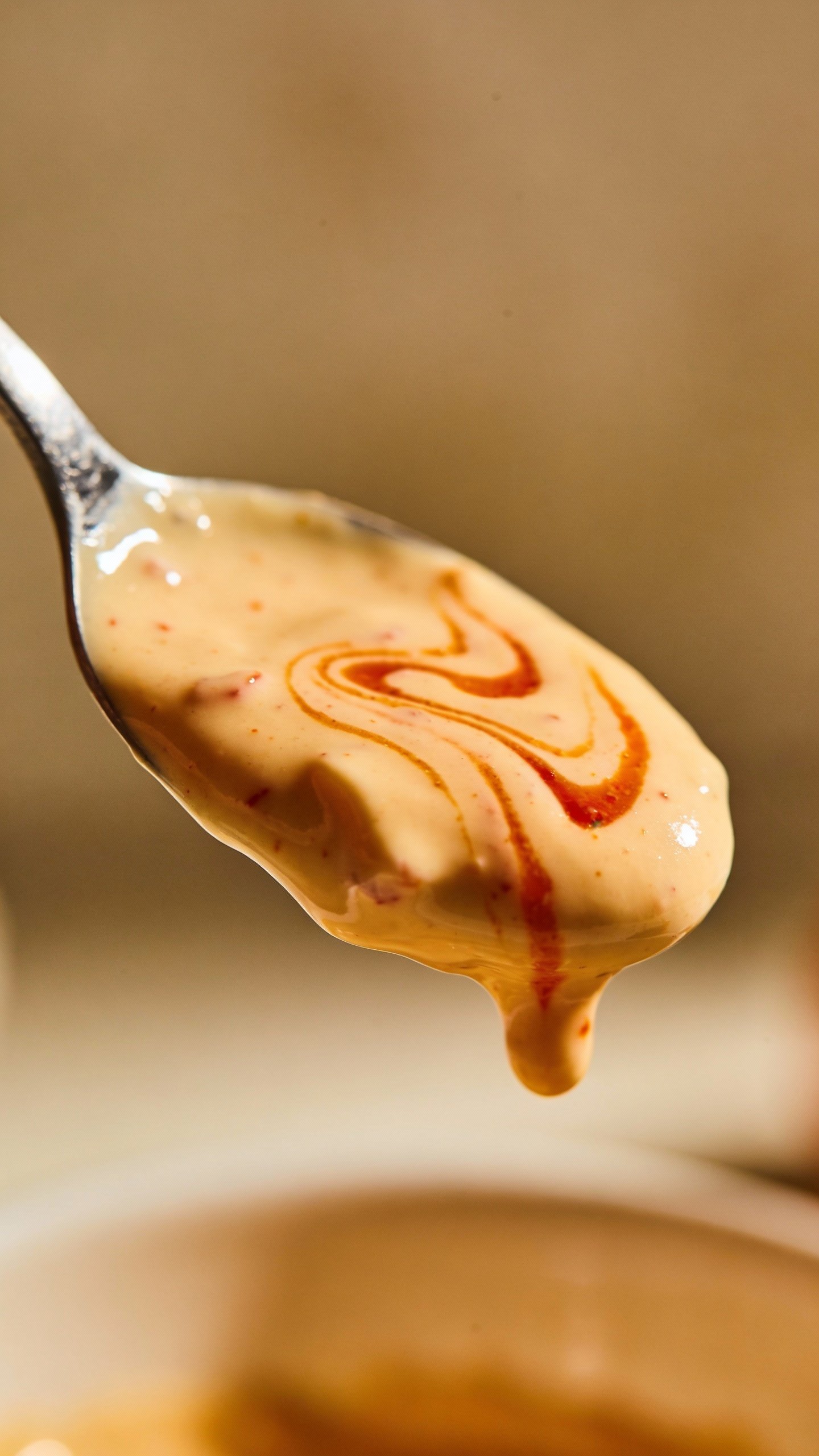 spoonful of creamy sriracha mayo dressing
