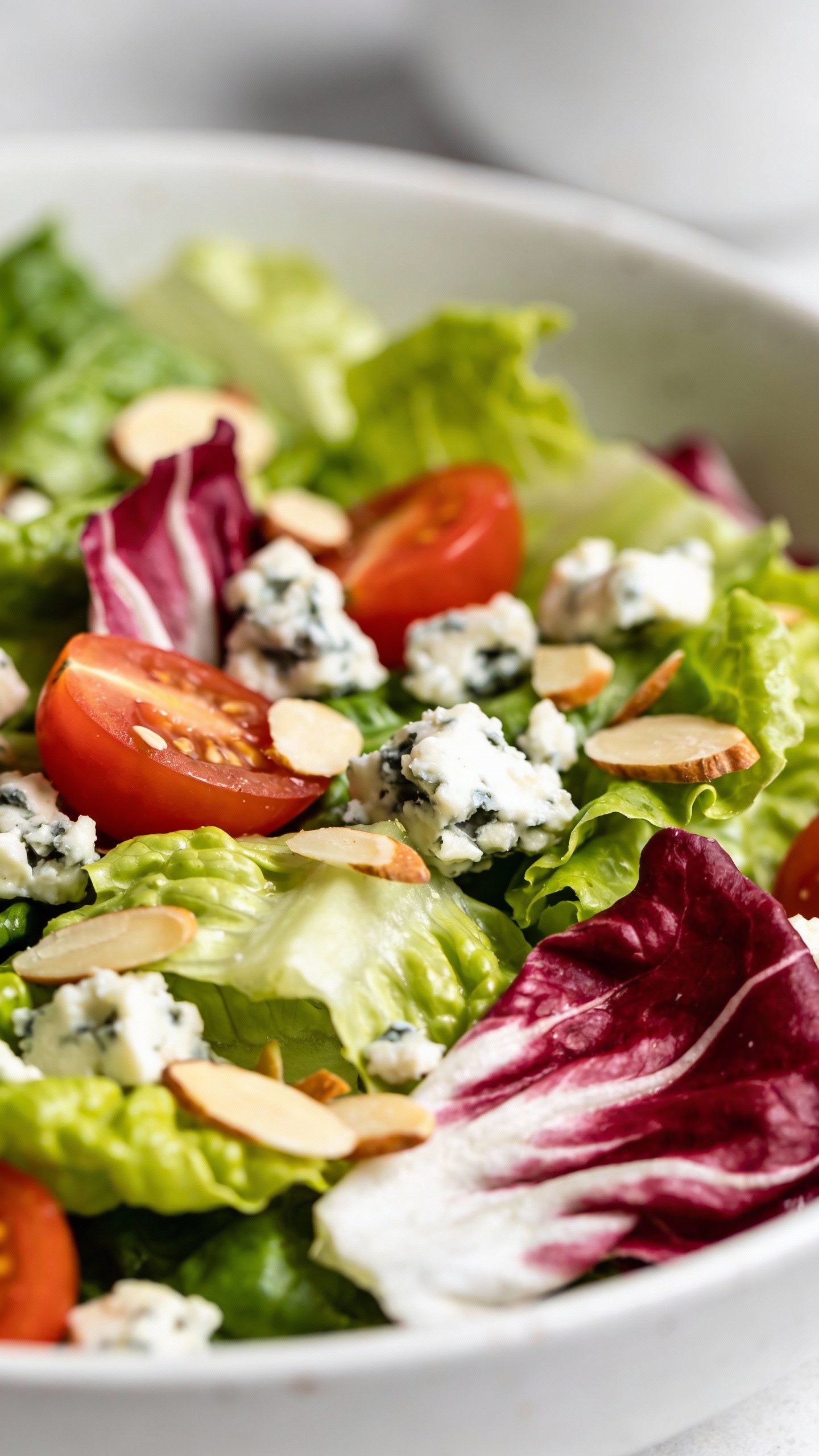 closeup of romaine and radicchio keto salad in white bowl