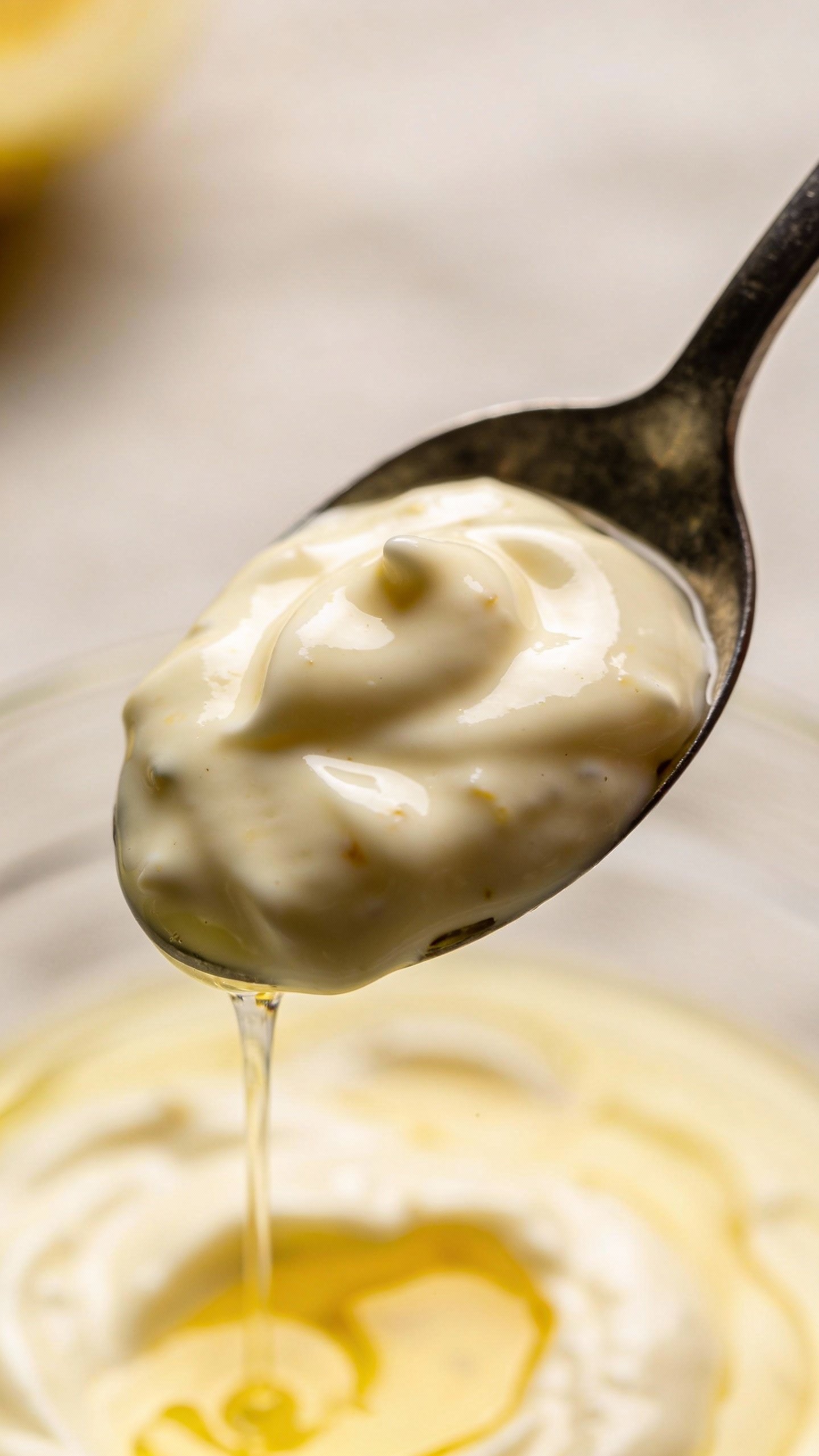 spoonful of creamy mayo dressing with lemon and vinegar