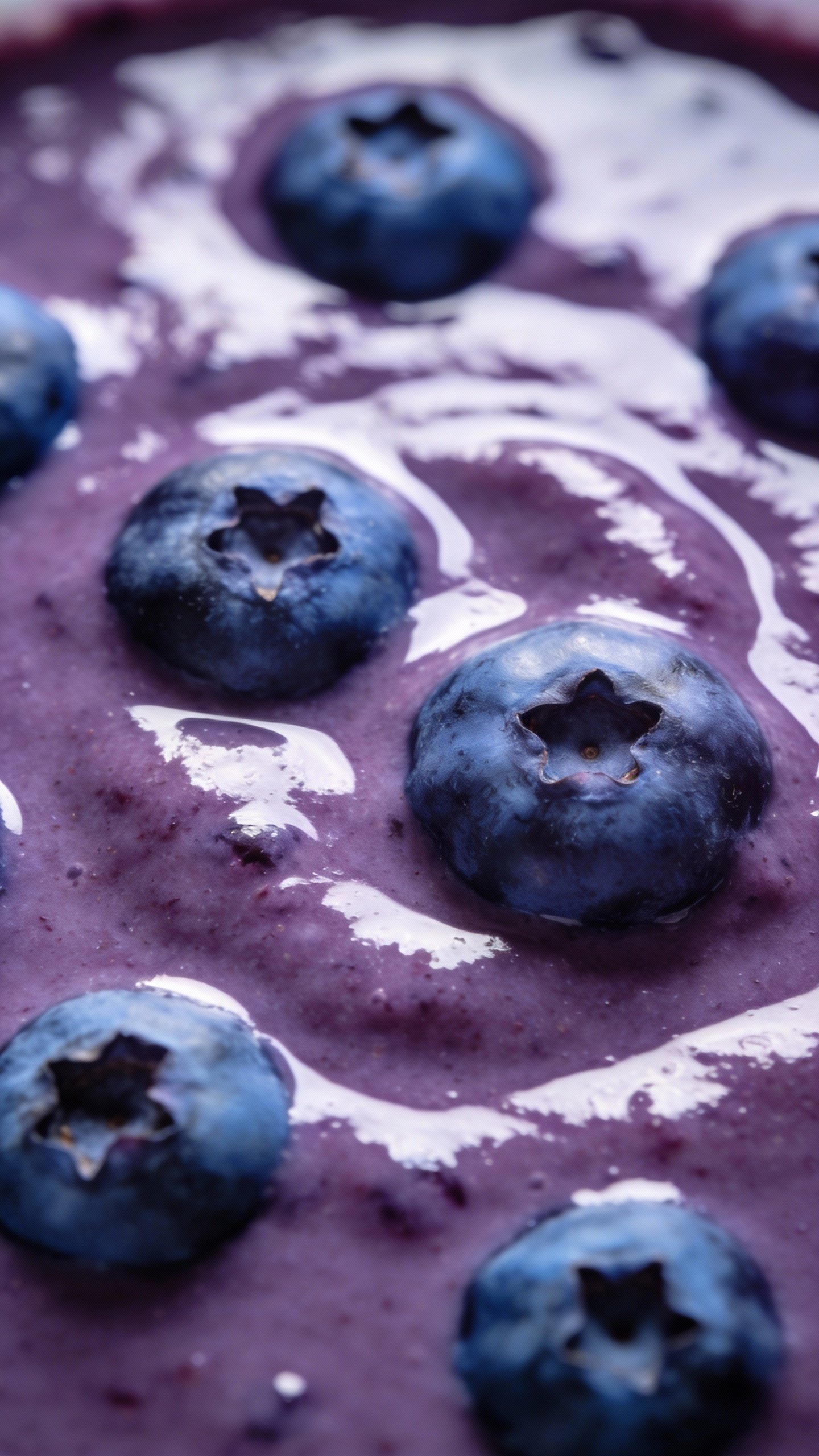 Blueberry-studded smoothie surface, overhead macro texture shot