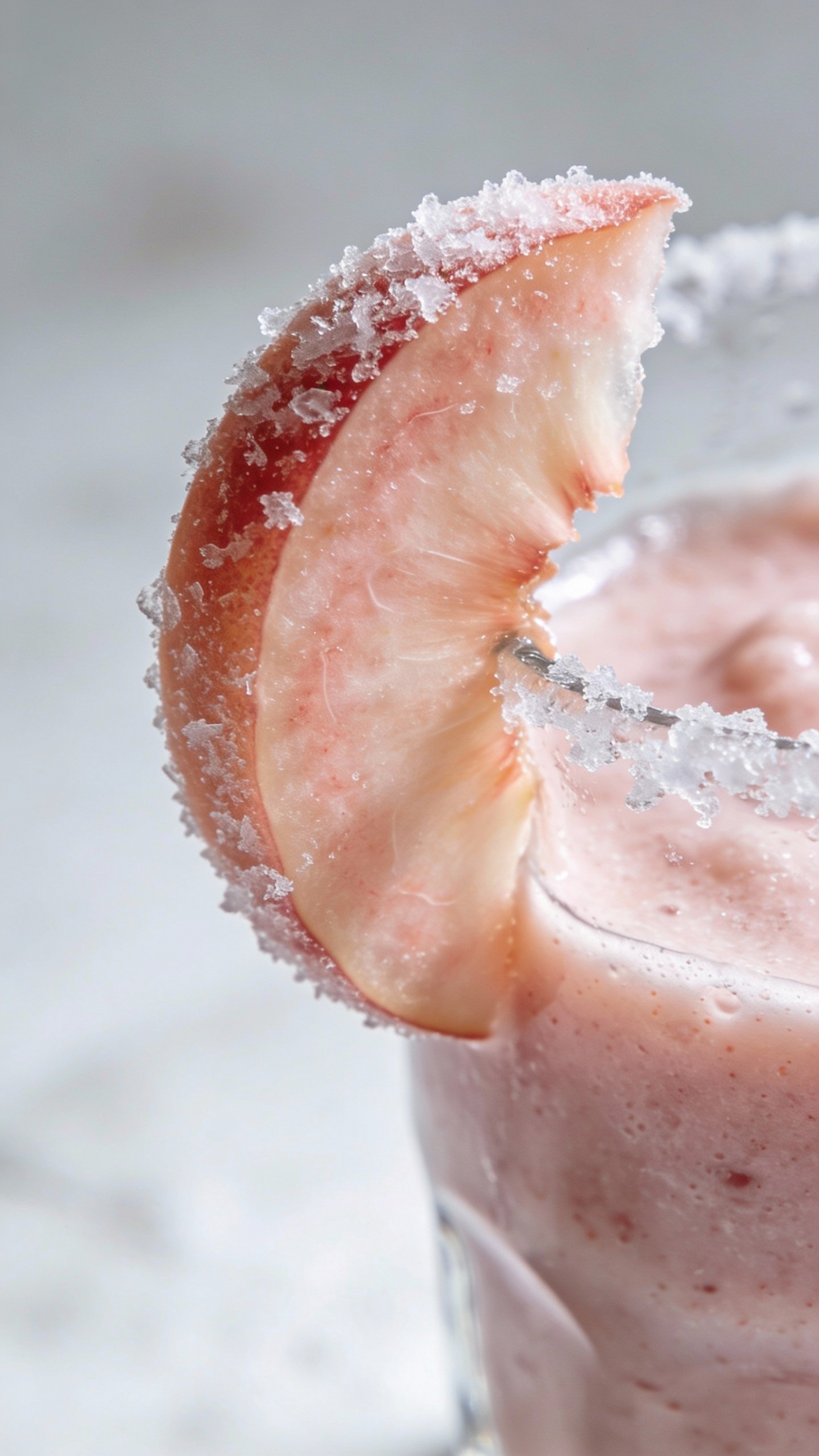 frosty peach slice garnish on smoothie rim, macro