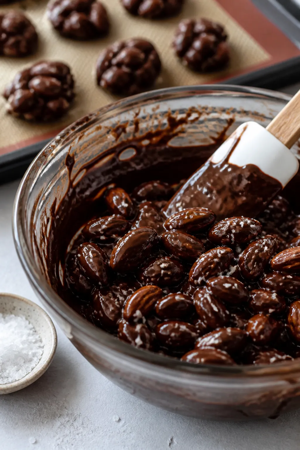 Cooking process shot: Close-up of glossy, melted sugar-free dark chocolate in a heatproof bowl, thic