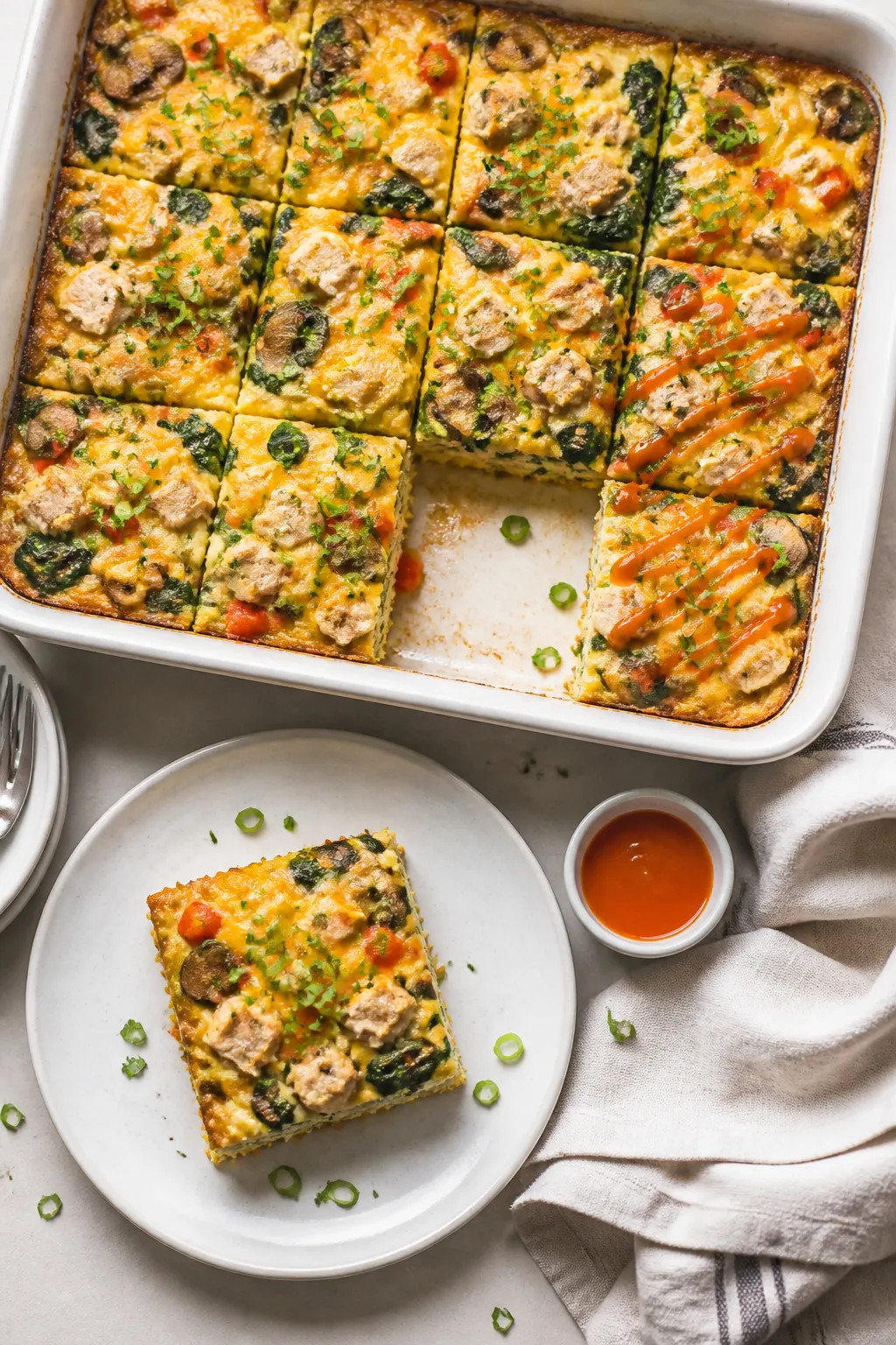 Final dish, tasty top view: Overhead shot of a 9x13 baked High Protein Turkey Breakfast Casserole ju
