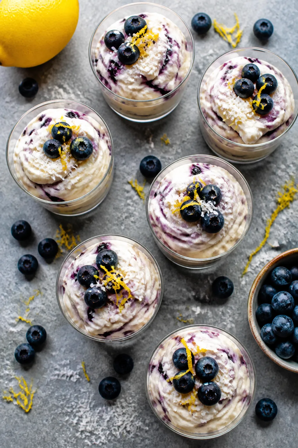 Final dish, tasty top view: Overhead shot of Low Carb Blueberry Cheesecake Fluff portioned into smal