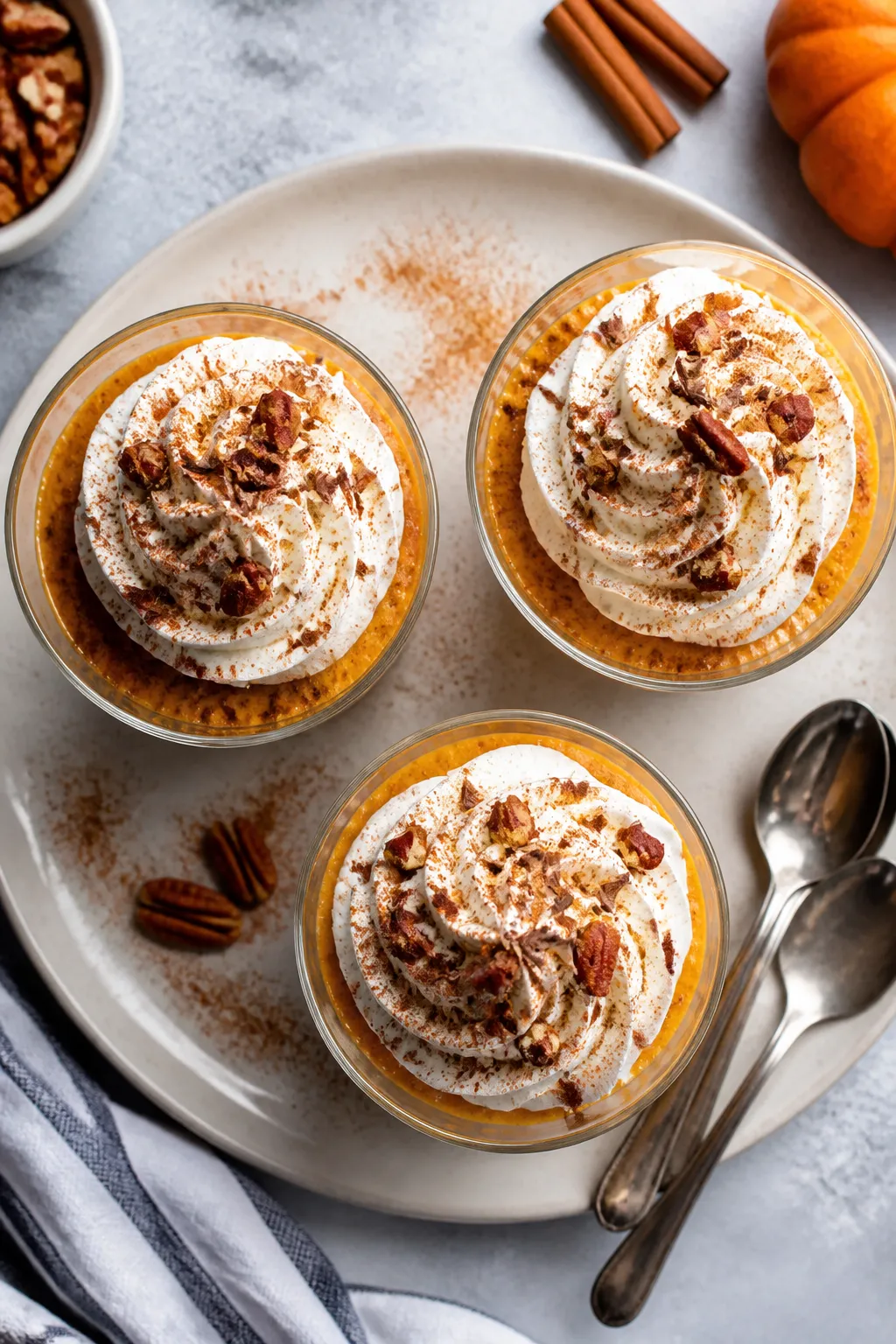 Final dish/top view: Overhead shot of low carb pumpkin spice mousse piped into small clear dessert g