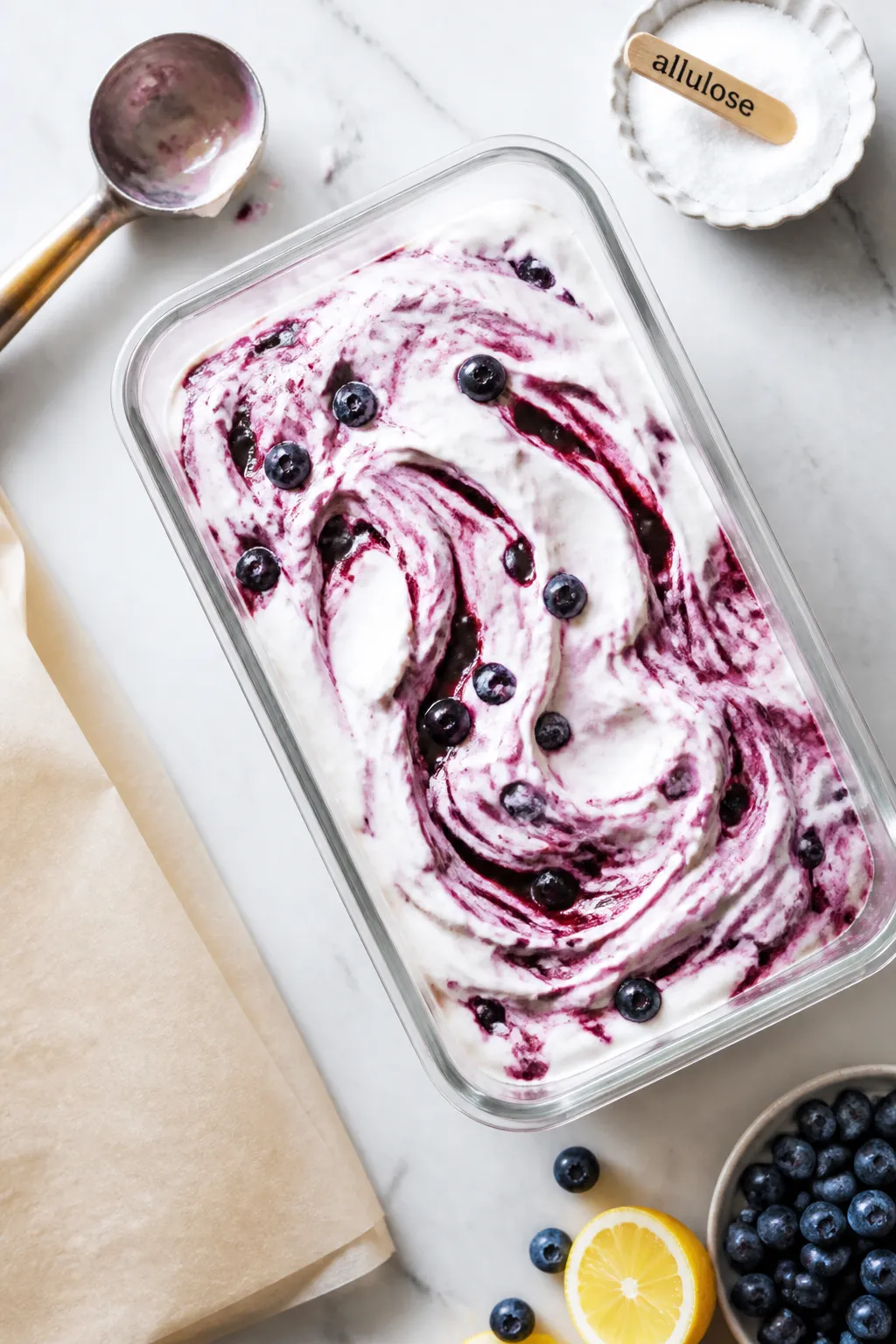 Overhead process shot of the prepared blueberry cottage cheese ice cream base just poured into a rec