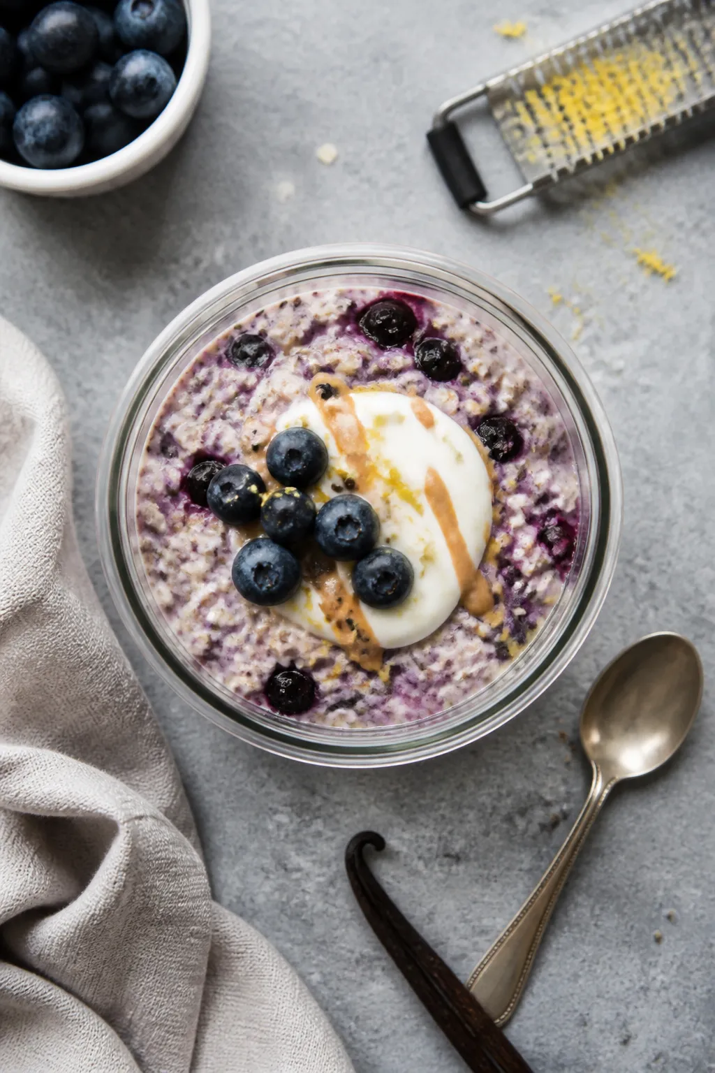 Overhead shot of prepared high-protein blueberry overnight oats just after an overnight chill, shown